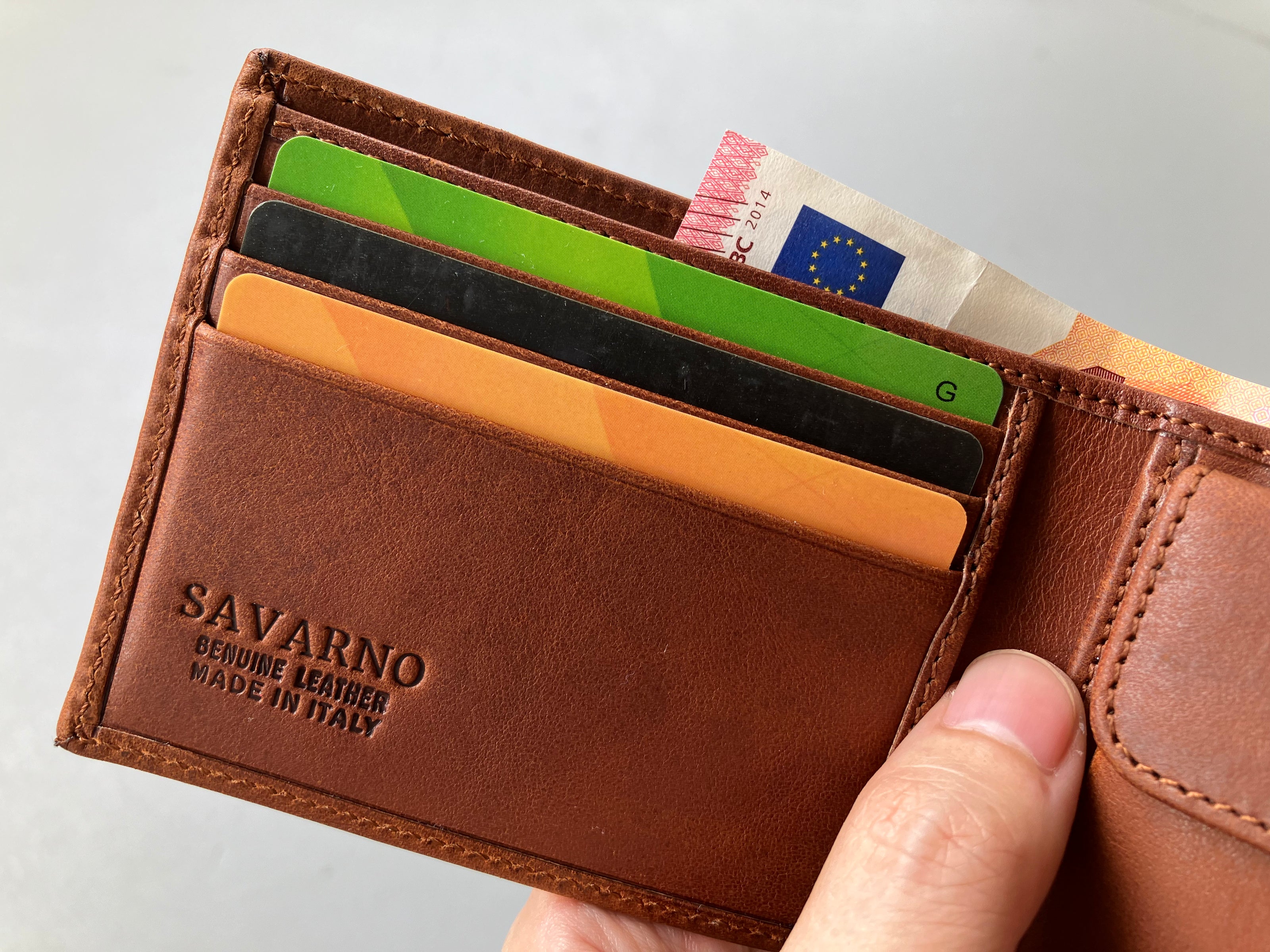 Savarno classic brown bi-fold wallet pictured with cards and cash